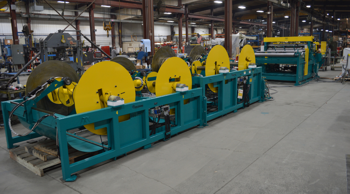 SLEAR, EconoSlear, Econo, Econo Slear, SLEER, multi-blanking, multi-blanking system, mbl, slitting, slitter, slitter arbor, slitter blades, slitter blade access door, cut-to-length, CTL, stock reel, uncoiler, drop-in uncoiler, multi-coil uncoiler, coil reel, payoff reel, motorized uncoiler, powered uncoiler, coil select, coil select station, coil select pinch rolls, straightener, powered stock straightener, stock straightener, metal coil straightener, peeler table, peeler/threader table, peeler blade, flying shear, flying cutoff, cutoff shear, motorized flying shear, traveling shear, close tolerance, close tolerance package, computerized control, touchscreen, touchscreen HMI